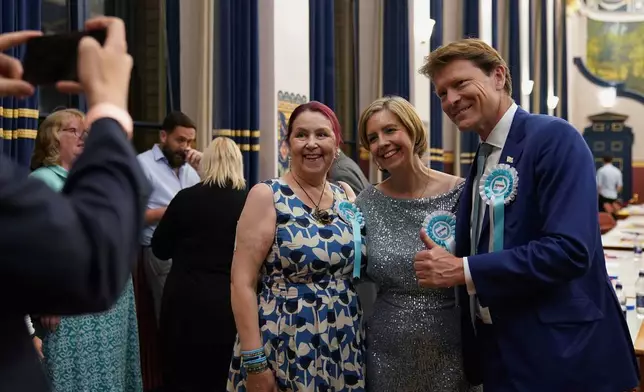 Reform UK's Greater Lincolnshire mayoral candidate Dame Andrea Jenkyns, centre, with Reform U.K. deputy leader Richard Tice, right, during the count at Grimsby Town Hall, in Lincolnshire, England, for the Greater Lincolnshire Mayor election, Friday, May 2, 2025. (Joe Giddens/PA via AP)