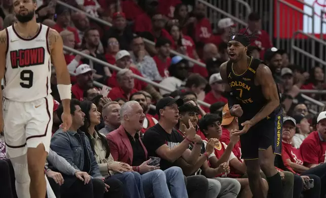 Golden State Warriors' Buddy Hield (7) reacts after making a three-pointer as Houston Rockets' Dillon Brooks (9) reacts during the first half of Game 7 of an NBA basketball first-round playoff series Sunday, May 4, 2025, in Houston. (AP Photo/Ashley Landis)