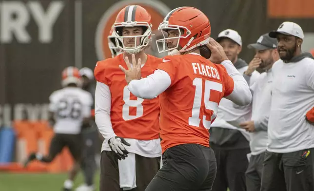 Cleveland Browns quarterback Joe Flacco (15) throws as Kenny Pickett watches during an NFL football practice, Wednesday, May 28, 2025, in Berea, Ohio. (AP Photo/Phil Long)