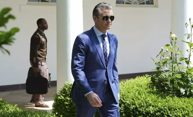 Defense Secretary Pete Hegseth arrives before President Donald Trump speaks during a National Day of Prayer event in the Rose Garden of the White House, Thursday, May 1, 2025, in Washington. (AP Photo/Evan Vucci)