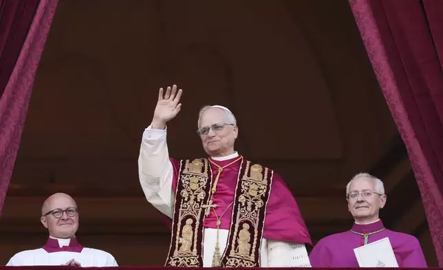 Pope Leo XIV appears on the central loggia of St. Peter's Basilica after being chosen the 267th pontiff of the Roman Catholic Church, at the Vatican, Thursday, May 8, 2025. (AP Photo/Alessandra Tarantino)