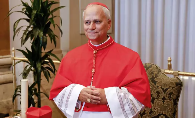 FILE - New Cardinal Robert Francis Prevost, prefect of the Dicastery for Bishops, stands for a portrait at the end of the consistory where Pope Francis elevated 21 new cardinals in St. Peter's Square at the Vatican, Sept. 30, 2023. (AP Photo/Riccardo De Luca, File)