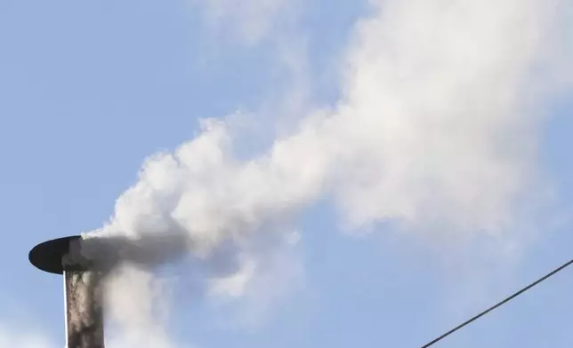 White smoke billows from the chimney of the Sistine Chapel during the conclave to elect a new pope, at the Vatican, Thursday, May 8, 2025. (AP Photo/Andrew Medichini)