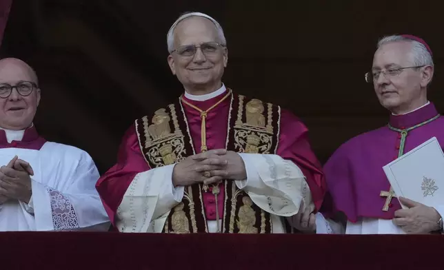 Newly elected Pope Leone XIV appears at the balcony of St. Peter's Basilica at the Vatican, Thursday, May 8, 2025. (AP Photo/Andrew Medichini)