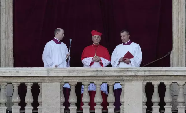 Cardinal Dominique Mamberti announces the election of Cardinal Robert F. Prevost as the 267th pope, choosing the name of Pope Leone XIV, at the Vatican, Thursday, May 8, 2025. (AP Photo/Bernat Armangue)