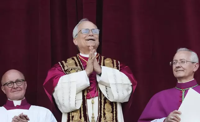 Newly elected Pope Leo XIV appears at the balcony of St. Peter's Basilica at the Vatican, Thursday, May 8, 2025. (AP Photo/Alessandra Tarantino)