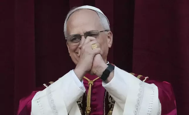 Newly elected Pope Leo XIV appears at the balcony of St. Peter's Basilica at the Vatican, Thursday, May 8, 2025. (AP Photo/Alessandra Tarantino)