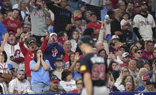 Fans react as Atlanta Braves pitcher Spencer Strider is pulled during the fifth inning of a baseball game against the Philadelphia Phillies Tuesday, May 27, 2025, in Philadelphia. (AP Photo/Matt Slocum)