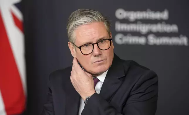 FILE - Britain's Prime Minister Keir Starmer leads a roundtable discussion at the Border Security Summit in London, March 31, 2025.(AP Photo/Kin Cheung, Pool, file)