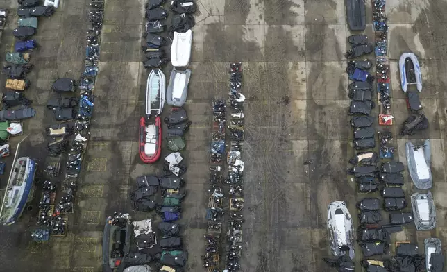 FILE - A general view of small boats and inflatable dinghies in a Border Force compound after being confiscated from migrants attempting to cross the channel to Britain from France, in Dover, England, Feb. 26, 2025. (AP Photo, file)
