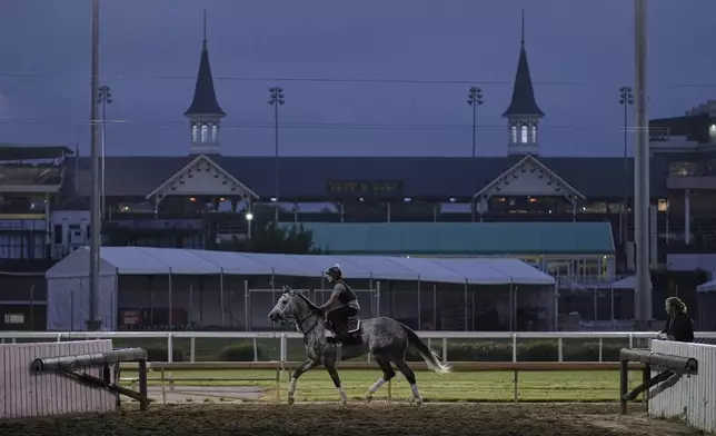 A race horse works out at Churchill Downs Wednesday, April 30, 2025, in Louisville, Ky. (AP Photo/Charlie Riedel)