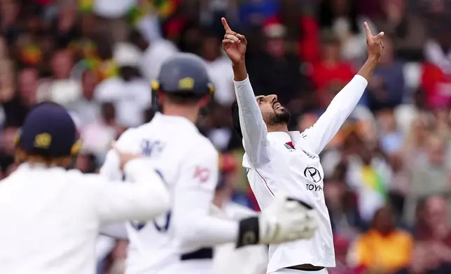 England's Shoaib Bashir celebrates taking the wicket of Zimbabwe's Sikandar Raza on day three on day three of the Rothesay International Test match between England and Zimbabwe at Trent Bridge, Nottingham, England, Saturday, May 24, 2025. (Mike Egerton/PA via AP)