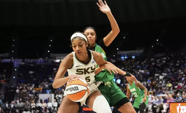 Brazil forward Manu Alves defends against Chicago Sky forward Angel Reese (5) in the second half a WNBA exhibition basketball game in Baton Rouge, La., Friday, May 2, 2025. (AP Photo/Gerald Herbert)