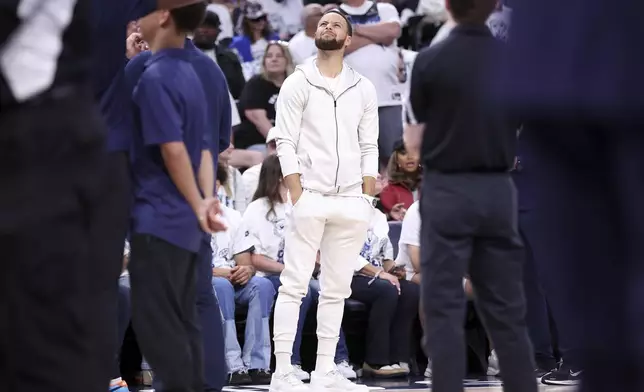 Golden State Warriors' Stephen Curry squints at the scoreboard in 2nd quarter against Minnesota Timberwolves in NBA Western Conference Semifinals' Game 5 at Target Center in Minneapolis on Wednesday, May 14, 2025. (Scott Strazzante/San Francisco Chronicle via AP)