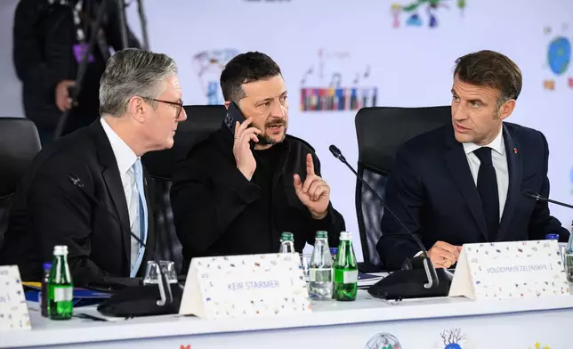 Britain's Prime Minister Keir Starmer, left, Ukraine's President Volodymyr Zelenskyy and France's President Emmanuel Macron, right, attend a plenary meeting at the beginning of a summit where the leaders of 47 European countries and organizations will discuss security, defense and democratic standards, in Tirana, Albania, Friday, May 16, 2025. (Leon Neal/Pool via AP)