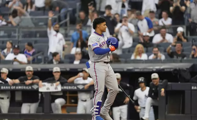 New York Mets' Juan Soto acknowledges the reaction of the crowd as he steps to the plate during the first inning of a baseball game against the New York Yankees Friday, May 16, 2025, in New York. (AP Photo/Seth Wenig)