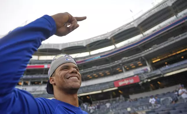 New York Mets' Juan Soto greets fans before a baseball game against the New York Yankees Friday, May 16, 2025, in New York. (AP Photo/Seth Wenig)