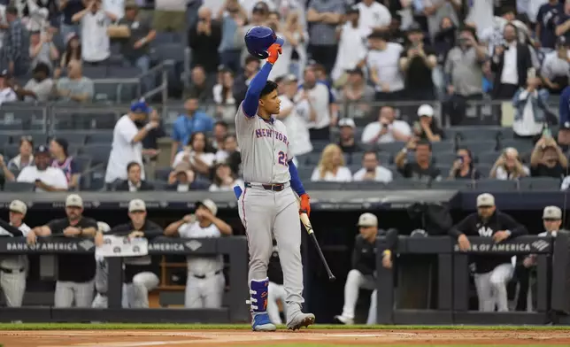 New York Mets' Juan Soto acknowledges the reaction of the crowd as he steps to the plate during the first inning of a baseball game against the New York Yankees Friday, May 16, 2025, in New York. (AP Photo/Seth Wenig)