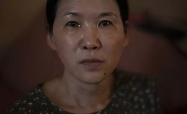 FILE - Yooree Kim, who was 11 when she was sent by an adoption agency to a couple in France, sits for a portrait as tears well up in her eyes in her apartment in Seoul, South Korea, Sunday, May 19, 2024. (AP Photo/Jae C. Hong, File)