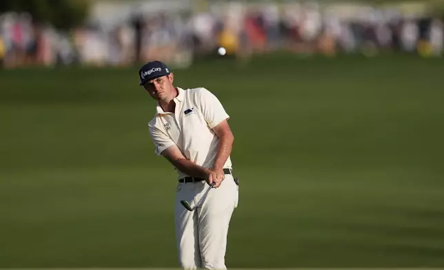 J.T. Poston chips to the green on the 18th hole during the final round of the PGA Championship golf tournament at the Quail Hollow Club, Sunday, May 18, 2025, in Charlotte, N.C. (AP Photo/George Walker IV)