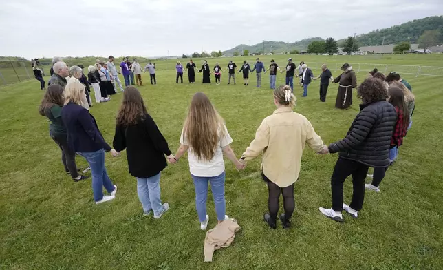 FILE - Capital punishment protesters pray on the grounds of Riverbend Maximum Security Institution before the scheduled execution of inmate Oscar Smith, April 21, 2022, in Nashville, Tenn. AP Photo/Mark Humphrey, File)