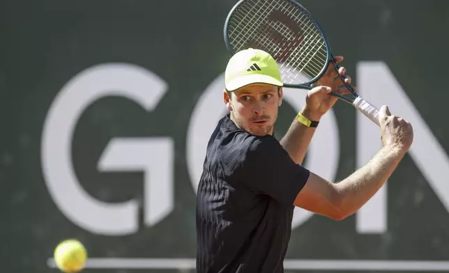 Hubert Hurkacz of Poland returns a ball to Novak Djokovic of Serbia during their final match of the ATP 250 Geneva Open tennis, in Geneva, Switzerland, Saturday, May 24, 2025. (Martial Trezzini/Keystone via AP)