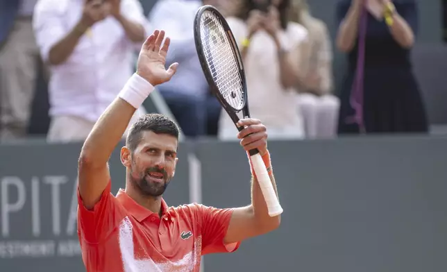 Novak Djokovic of Serbia celebrates after winning the final match of the ATP 250 Geneva Open tennis against Hubert Hurkacz of Poland, in Geneva, Switzerland, Saturday, May 24, 2025. (Martial Trezzini/Keystone via AP)