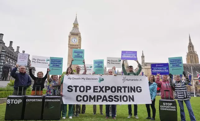 Pro-assisted dying campaigners gather outside Parliament ahead of Fridays report stage in the Commons on The Terminally Ill Adults (End of Life) Bill, which is expected to see MPs vote on further amendments, in Westminster in London, Thursday, May 15, 2025. (AP Photo/Kirsty Wigglesworth)