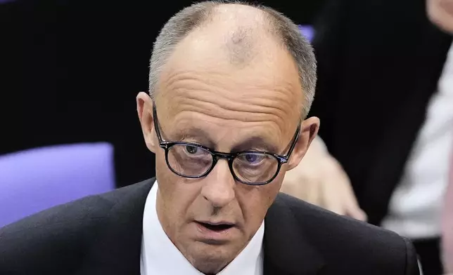 Friedrich Merz reacts after he failed to be elected new chancellor in first round vote at the German federal parliament, Bundestag, at the Reichstag building in Berlin, Tuesday, May 6, 2025. (AP Photo/Markus Schreiber)