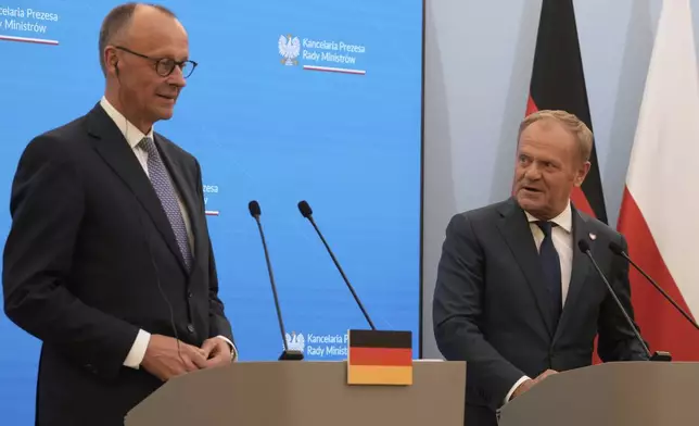 Polish Prime Minister Donald Tusk, right, and German Chancellor Friedrich Merz attend a joint press conference following their meeting in Warsaw, Poland, Wednesday, May 7, 2025. (AP Photo/Czarek Sokolowski)