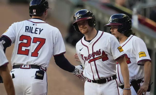 Atlanta Braves third baseman Austin Riley (27) celebrates after hitting a two-run homer against the Los Angeles Dodgers in the first inning of a baseball game, Sunday, May 4, 2025, in Atlanta. (AP Photo/Mike Stewart)