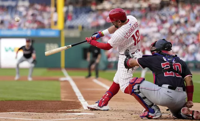 Philadelphia Phillies' Kyle Schwarber hits a two-run home run against Washington Nationals pitcher MacKenzie Gore during the first inning of a baseball game, Tuesday, April 29, 2025, in Philadelphia. (AP Photo/Matt Slocum)