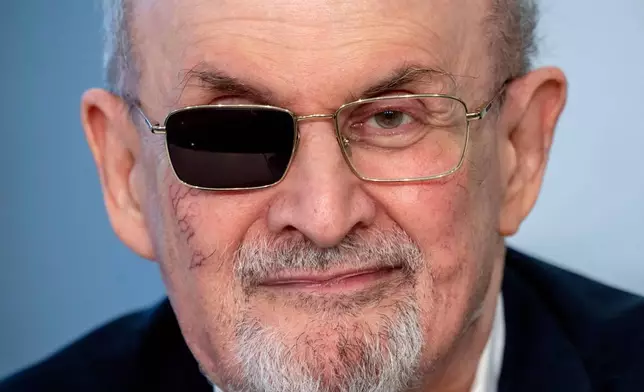 FILE - Author Salman Rushdie appears at a press conference at the Book Fair in Frankfurt, Germany on Oct. 20, 2023. (AP Photo/Michael Probst, File)