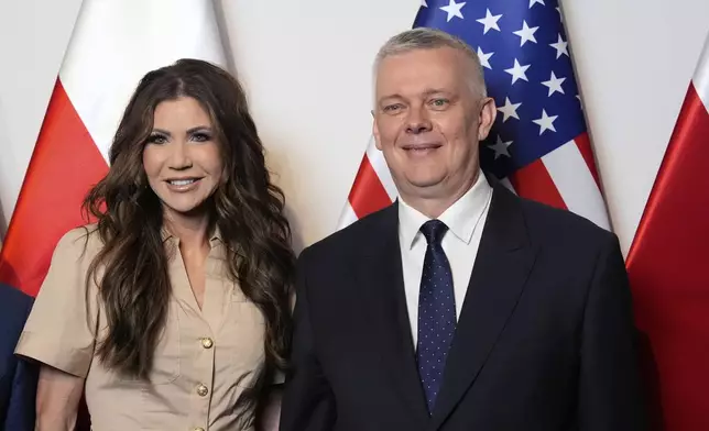 Homeland Security Secretary Kristi Noem, left, poses with Poland's Interior Minister Tomasz Siemoniak, Tuesday, May 27, 2025, in Rzeszów, Poland (AP Photo/Alex Brandon, Pool)