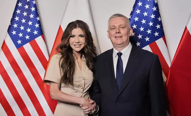 Homeland Security Secretary Kristi Noem, left, shakes hands with Poland's Interior Minister Tomasz Siemoniak, Tuesday, May 27, 2025, in Rzeszów, Poland (AP Photo/Alex Brandon, Pool)