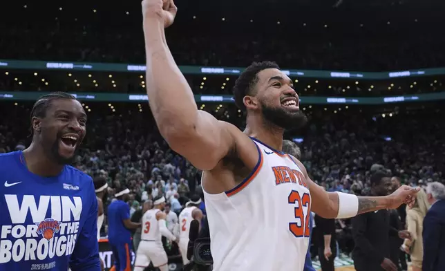 New York Knicks center Karl-Anthony Towns (32) celebrates after defeating the Boston Celtics in Game 2 of an NBA basketball second-round playoff series against the Boston Celtics, Wednesday, May 7, 2025, in Boston. (AP Photo/Charles Krupa)
