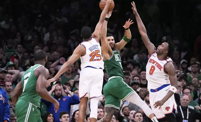 New York Knicks forward Mikal Bridges (25) blocks a pass by Boston Celtics forward Jayson Tatum in the final seconds of the second half of Game 2 of an NBA basketball second-round playoff series, Wednesday, May 7, 2025, in Boston. (AP Photo/Charles Krupa)
