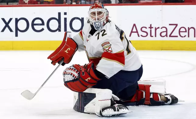 Florida Panthers goaltender Sergei Bobrovsky (72) watches the puck against the Carolina Hurricanes during the second period of Game 5 of the NHL hockey Stanley Cup Eastern Conference finals in Raleigh, N.C., Wednesday, May 28, 2025. (AP Photo/Karl DeBlaker)