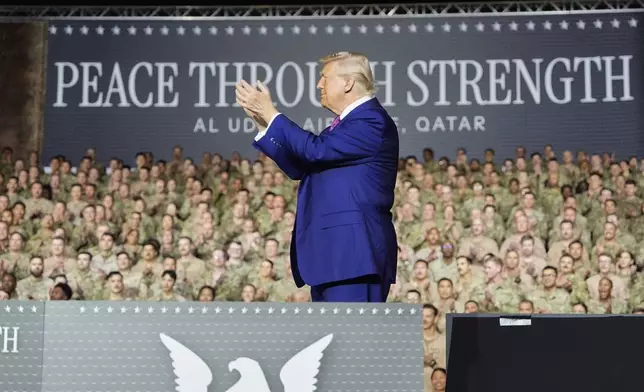 President Donald Trump applauds on stage at the Al Udeid Air Base, Thursday, May 15, 2025, in Doha, Qatar. (AP Photo/Alex Brandon)
