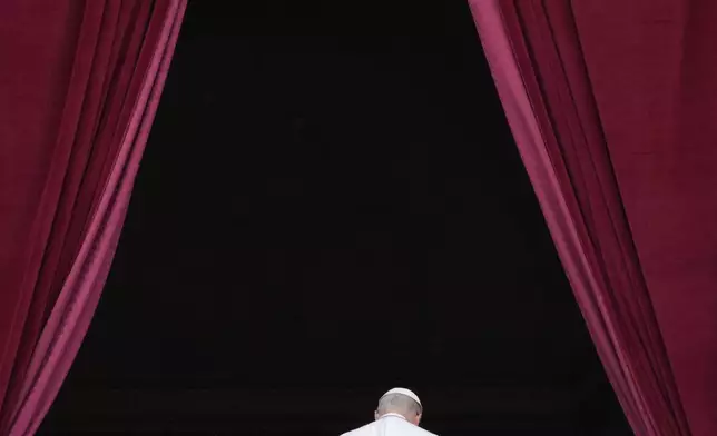 Pope Leo XIV leaves after delivering his message from the central balcony of St. Peter's Basilica for his first Sunday blessing after his election, in St. Peter's Square at the Vatican, Sunday, May 11, 2025.(AP Photo/Gregorio Borgia)