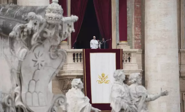 Pope Leo XIV appears at the central balcony of St. Peter's Basilica for his first Sunday blessing after his election, in St. Peter¥s Square at the Vatican, Sunday May 11, 2025. (AP Photo/Alessandra Tarantino)