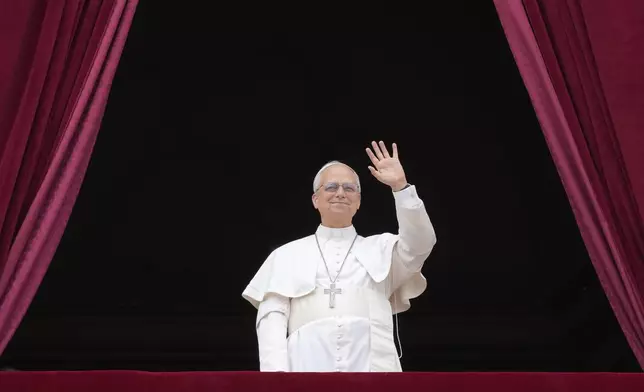 Pope Leo XIV appears at the central balcony of St. Peter's Basilica for his first Sunday blessing after his election, in St. Peter's Square at the Vatican, Sunday, May 11, 2025.(AP Photo/Gregorio Borgia)