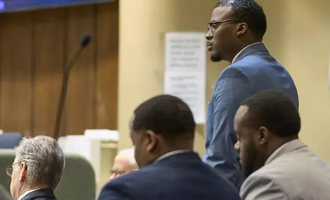 Former Memphis Police Department officer Justin Smith Jr., one of three former Memphis officers charged with fatally beating Tyre Nichols in 2023, stands in the courtroom during his trial, Monday, May 5, 2025, in Memphis, Tenn. (AP Photo/George Walker IV, Pool)