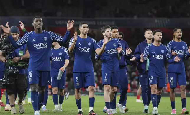 PSG players celebrate with their fans at the end of the Champions League semifinal first leg soccer match between Arsenal and Paris Saint-Germain at Arsenal Stadium in London, England, Tuesday, April 29, 2025. (AP Photo/Kin Cheung)