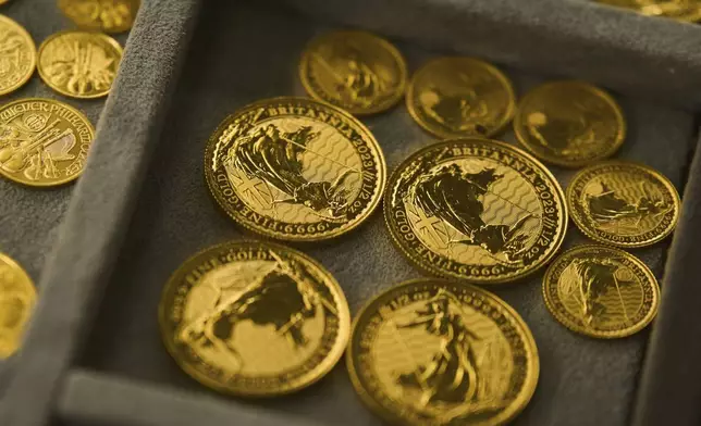 A collection of gold coins is displayed at a shop in the St. Vincent Jewelry Center in the Jewelry District of Los Angeles, Wednesday, April 30, 2025. (AP Photo/Jae C. Hong)