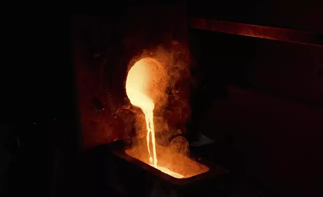 Molten gold is poured into a mold at A&amp;M Precious Metals in the St. Vincent Jewelry Center in the Jewelry District of Los Angeles, Friday, May 2, 2025. (AP Photo/Jae C. Hong)