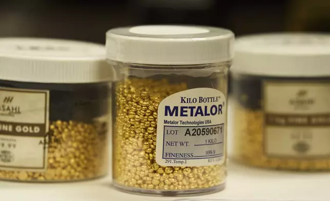 Containers holding gold granules are seen at A&amp;M Precious Metals in the St. Vincent Jewelry Center in the Jewelry District of Los Angeles, Friday, May 2, 2025. (AP Photo/Jae C. Hong)