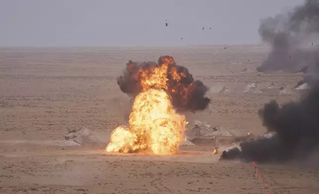 A target is hit with artillery fire as U.S and Moroccan military forces take part in the 21st edition of the African Lion military exercise, in Tantan, south of Agadir, Morocco, Friday, May 23, 2025. (AP Photo/Mosa'ab Elshamy)