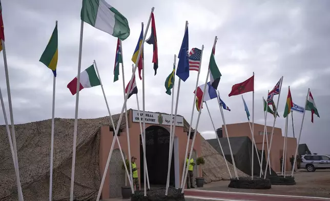 Flags of participating countries are placed outside an observatory during 21st edition of the African Lion military exercise, in Tantan, south of Agadir, Morocco, Friday, May 23, 2025. (AP Photo/Mosa'ab Elshamy)