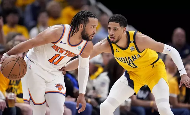 FILE - New York Knicks guard Jalen Brunson (11) drives past Indiana Pacers guard Tyrese Haliburton (0) during the second half of Game 3 in an NBA basketball second-round playoff series, Friday, May 10, 2024, in Indianapolis. (AP Photo/Michael Conroy, File)